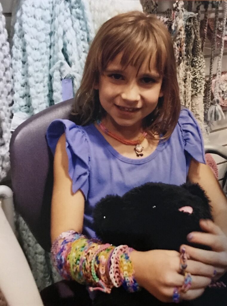 Young girl with a bob haircut and bangs