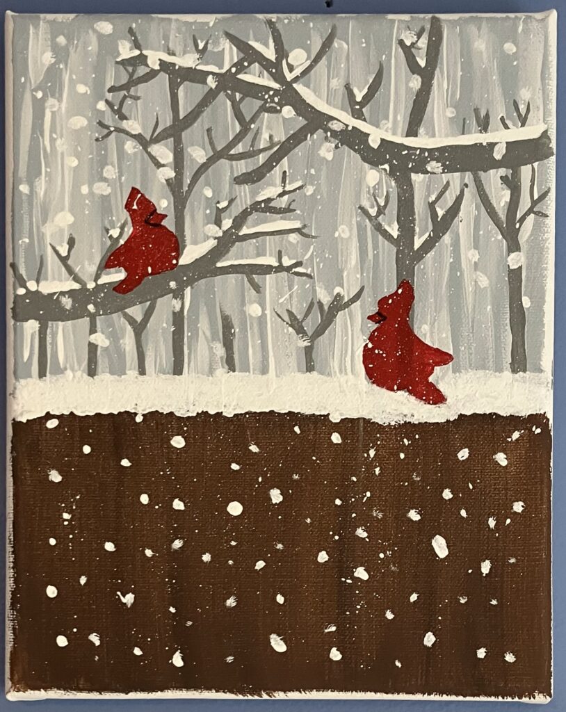 Acrylic painting on canvas of a grey, snowy winter's day. There are snow-covered trees in the background and a fence in the foreground. There are two red cardinals: one perched on the fence and another on a tree branch.