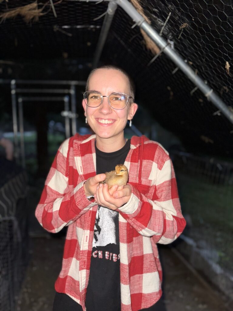 Me holding a baby chick.