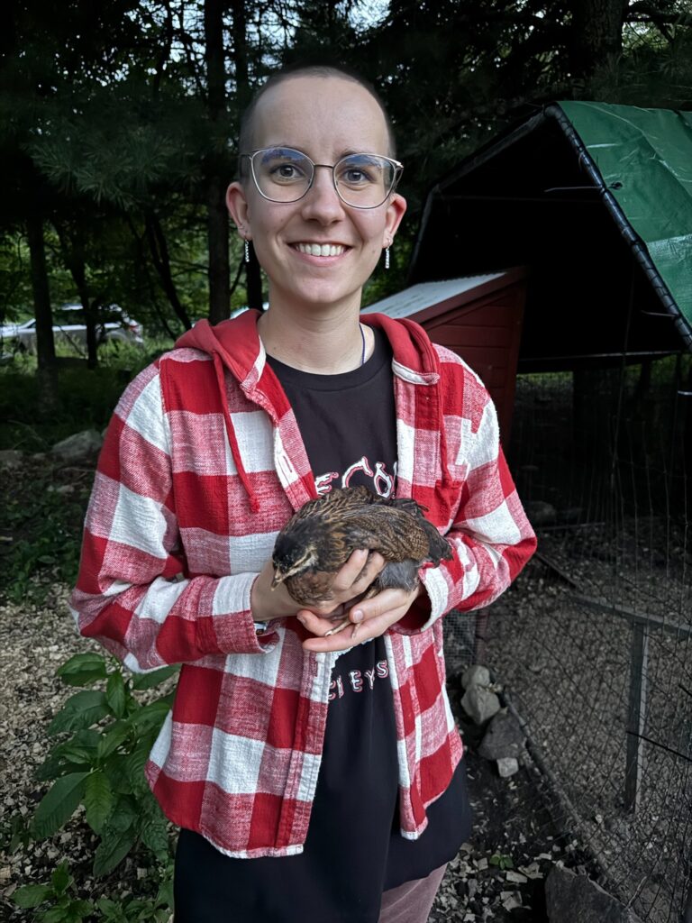 Me holding a teenage chicken.