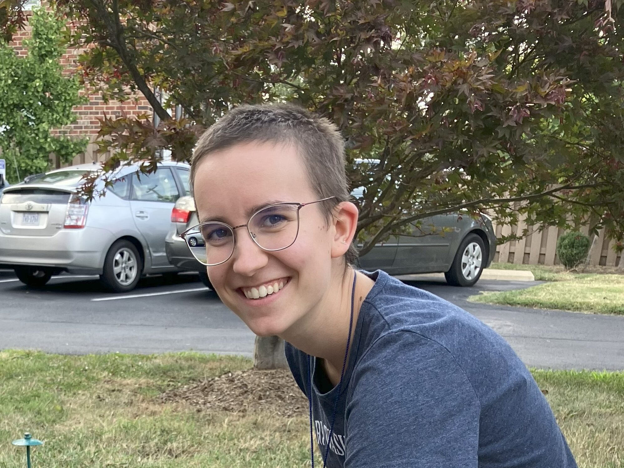 Me with hair slightly longer than a typical buzz cut.