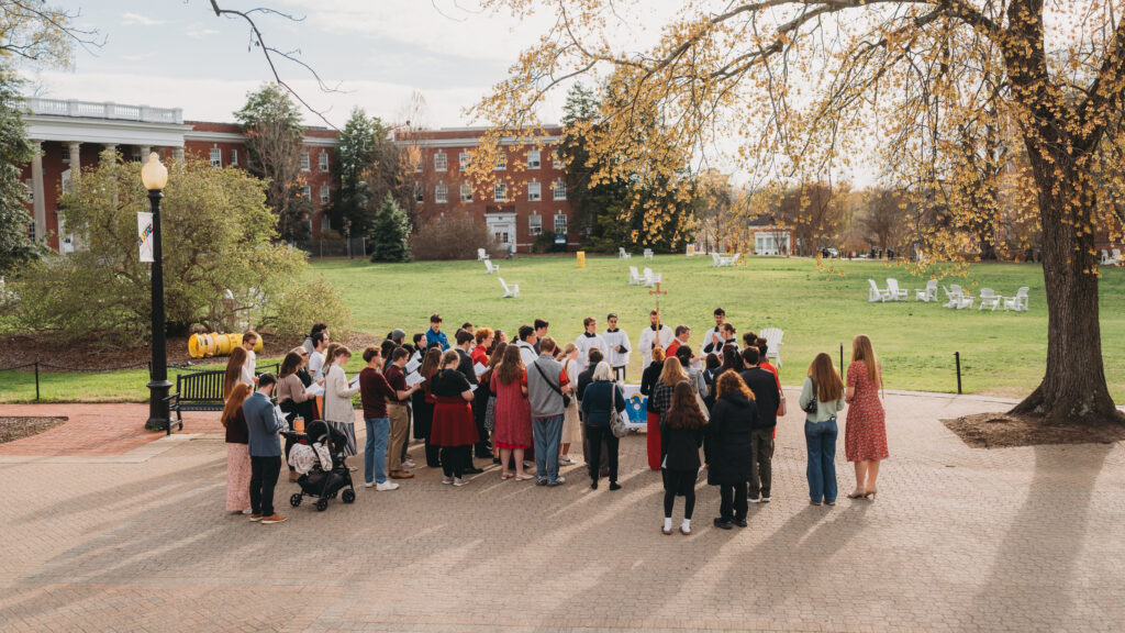 A crowd gathered around an altar in front of Ball Circle on Palm Sunday.