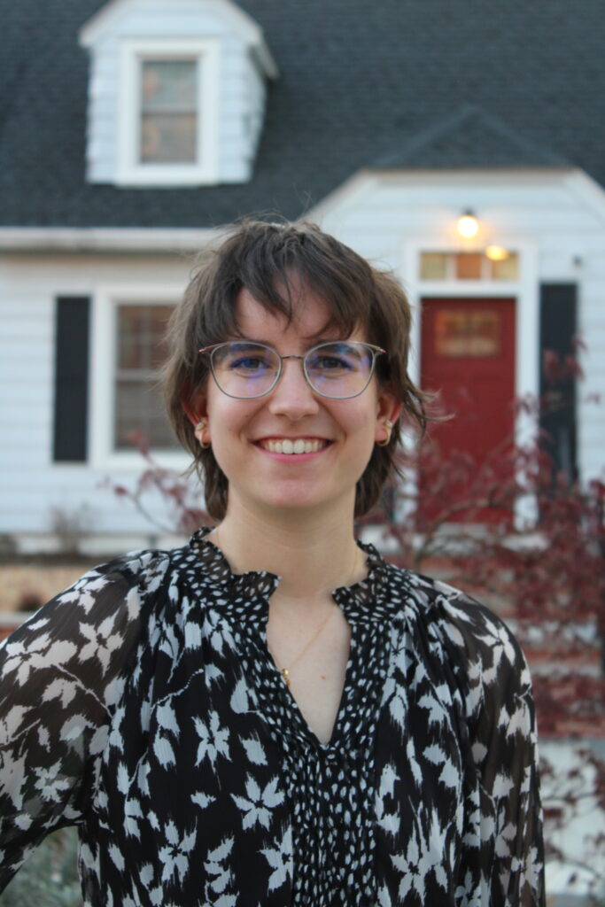 Lexi with messy bangs that go down to the tops of her glasses.